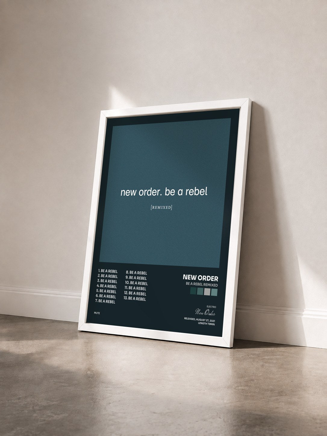 #blanc Be a Rebel Remixed di New Order in stampa incorniciata vista di tre quarti, cornice bianca