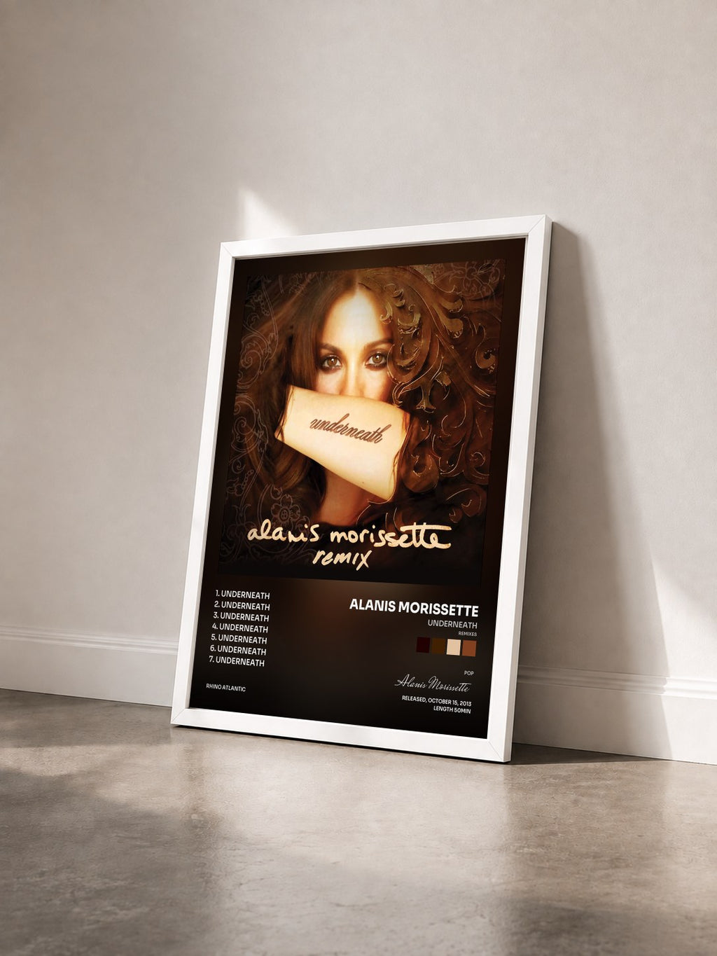 #blanc Tableau de l'album Underneath (Remixes) de Alanis Morissette vu de trois quarts, cadre blanc
