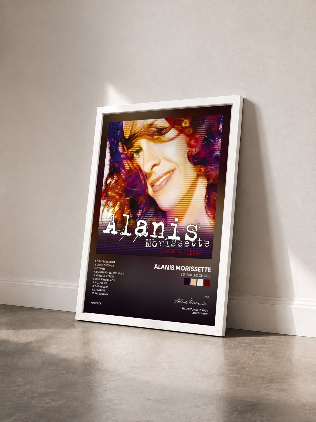 #blanc Tableau de l'album So-Called Chaos de Alanis Morissette vu de trois quarts, cadre blanc