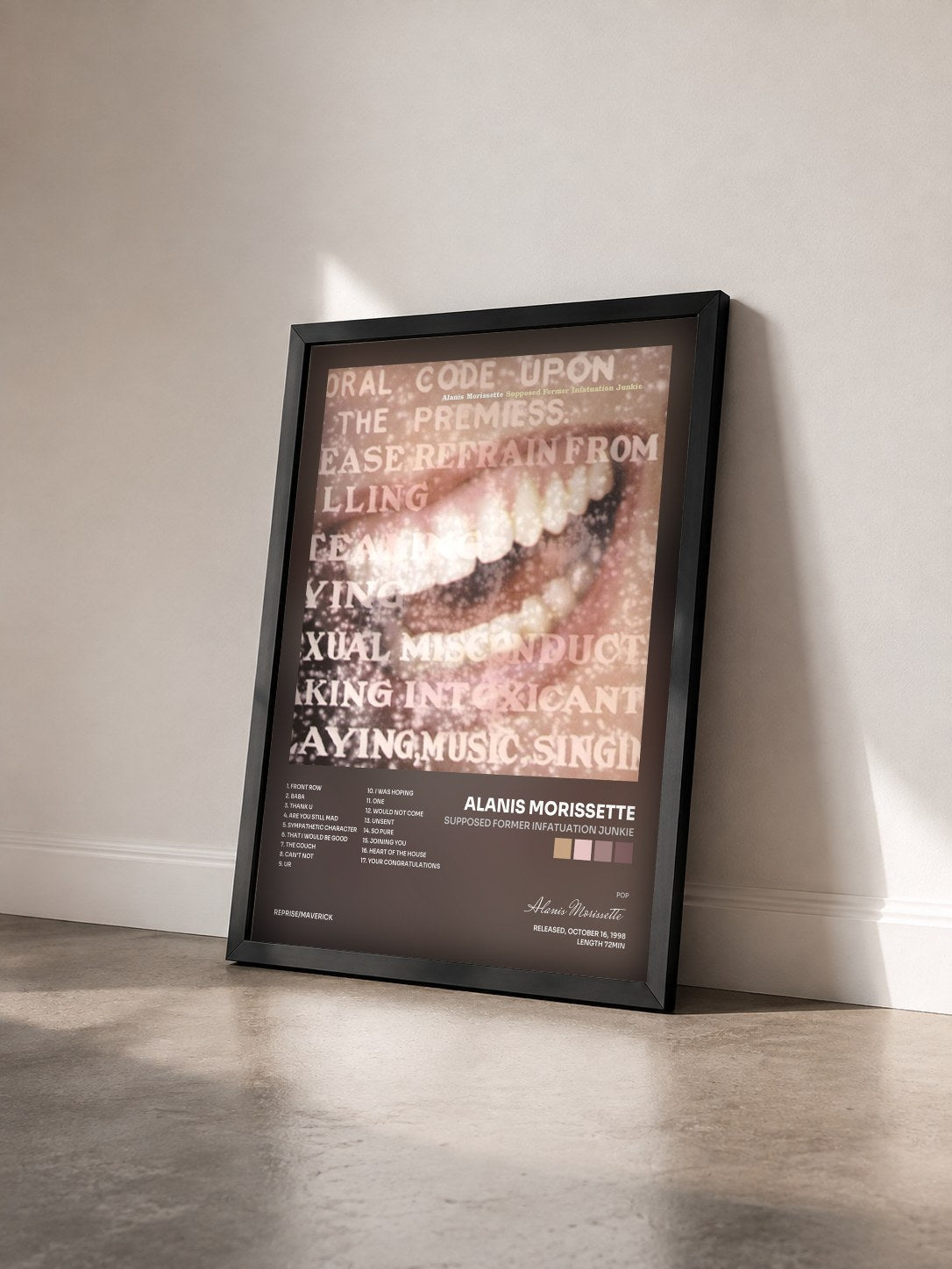 #noir Tableau de l'album Supposed Former Infatuation Junkie de Alanis Morissette vu de trois quarts, cadre noir