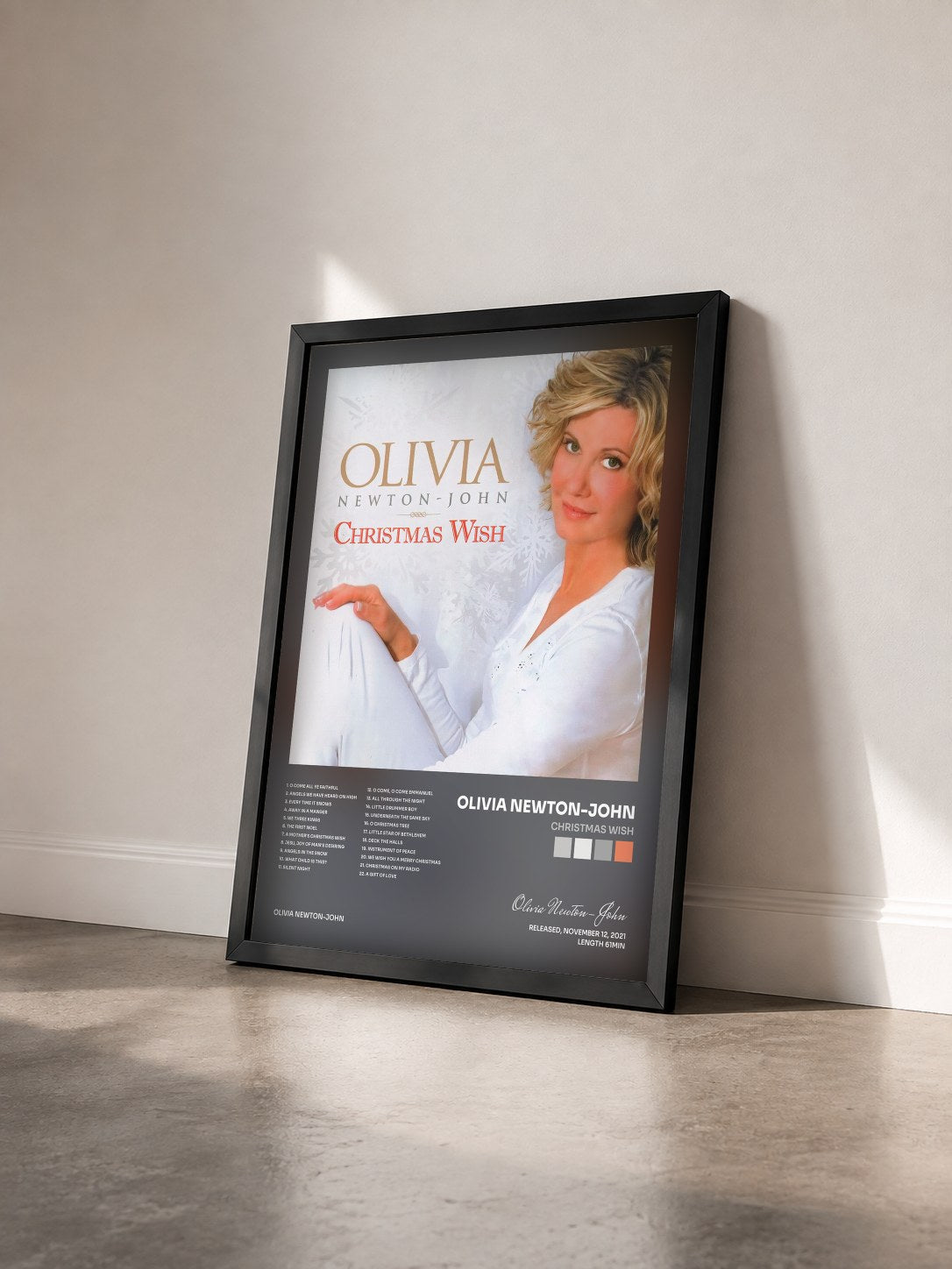 #noir Tableau de l'album Christmas Wish de Olivia Newton-John vu de trois quarts, cadre noir