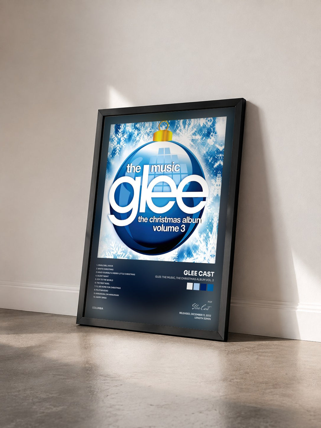 #noir Glee: The Music, The Christmas Album Vol. 3 by Glee Cast as a framed art print seen at an angle, black frame