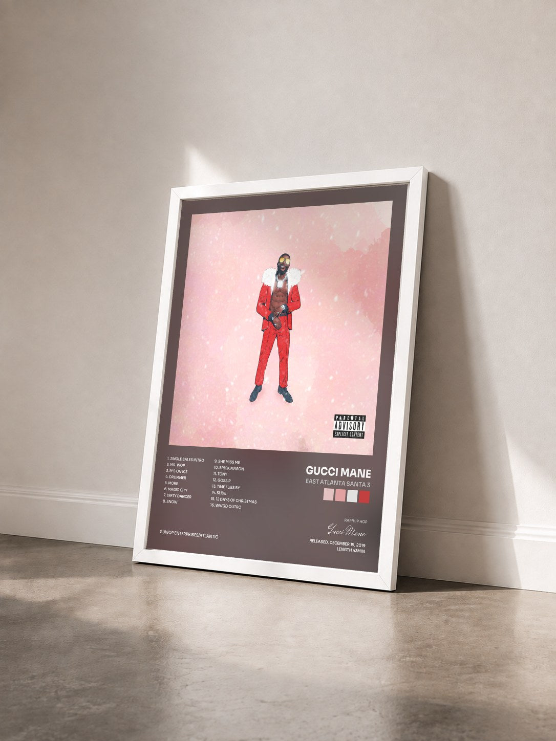 #blanc Tableau de l'album East Atlanta Santa 3 de Gucci Mane vu de trois quarts, cadre blanc