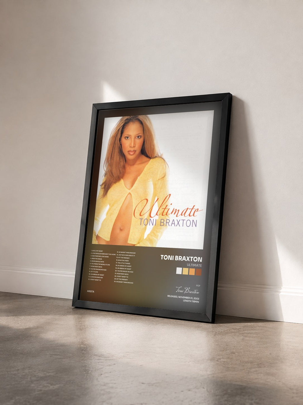 #noir Ultimate by Toni Braxton as a framed art print seen at an angle, black frame