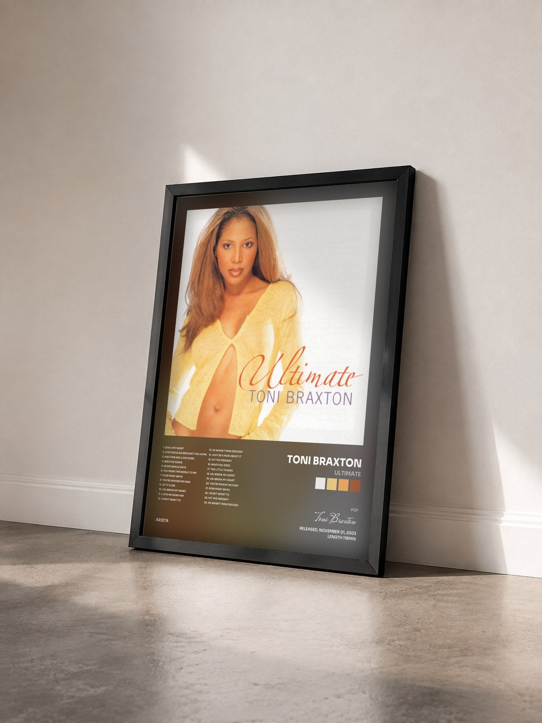 #noir Ultimate by Toni Braxton as a framed art print seen at an angle, black frame
