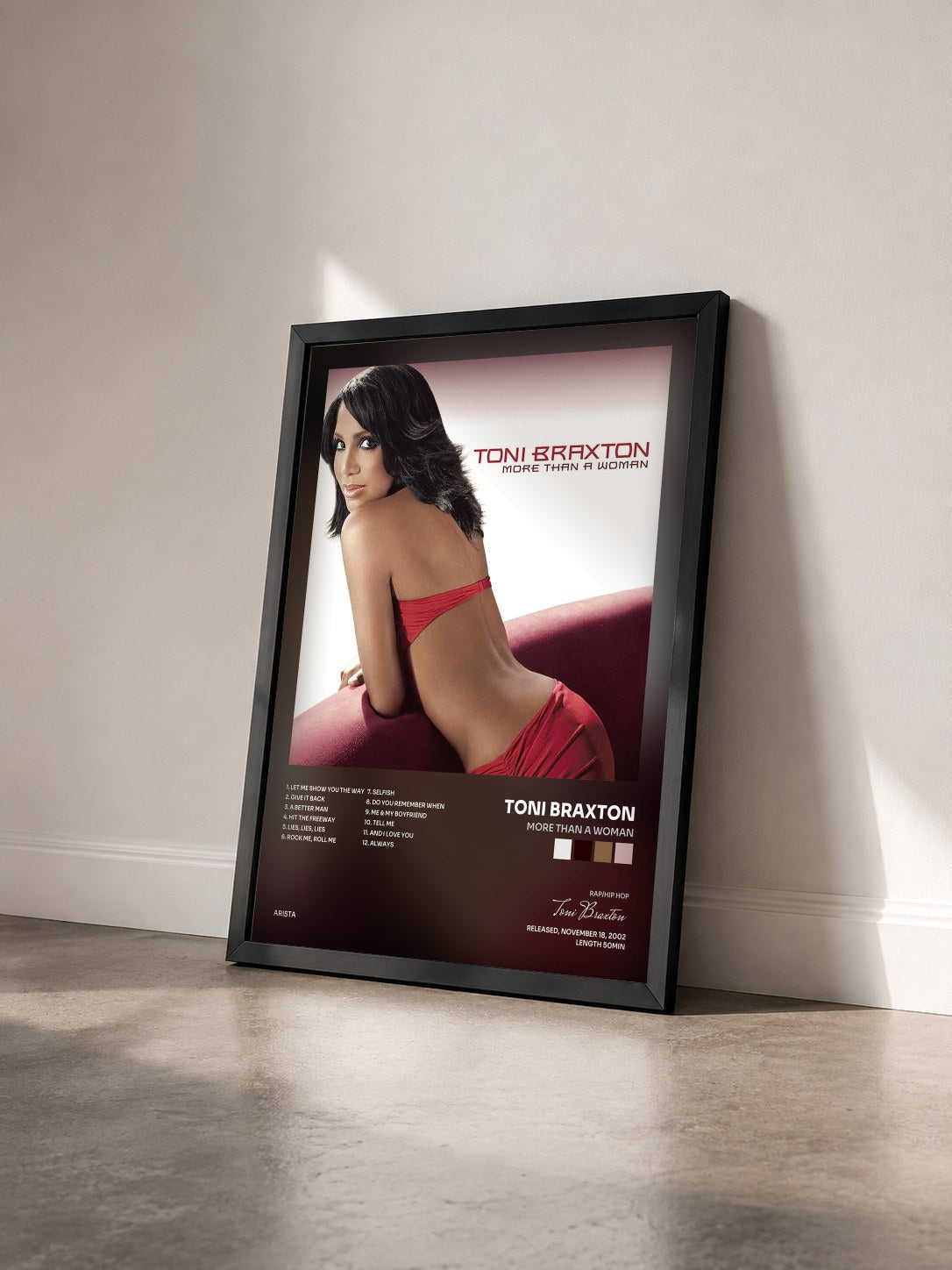 #noir More Than A Woman by Toni Braxton as a framed art print seen at an angle, black frame