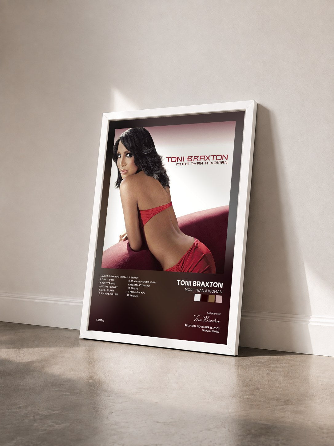 #blanc More Than A Woman by Toni Braxton as a framed art print seen at an angle, white frame