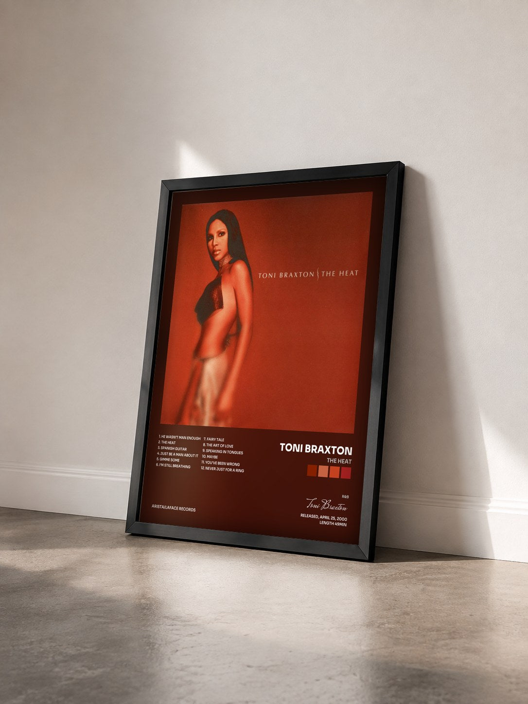 #noir The Heat by Toni Braxton as a framed art print seen at an angle, black frame