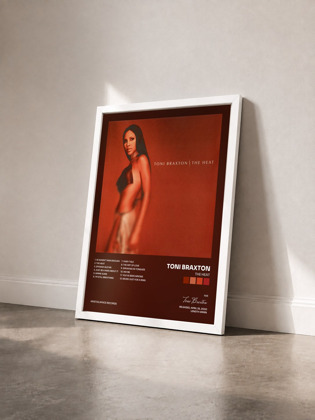 #blanc The Heat by Toni Braxton as a framed art print seen at an angle, white frame