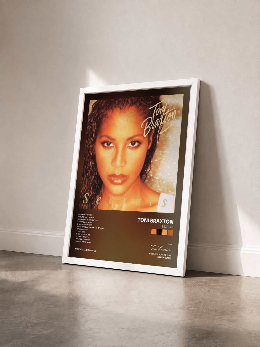 #blanc Secrets by Toni Braxton as a framed art print seen at an angle, white frame