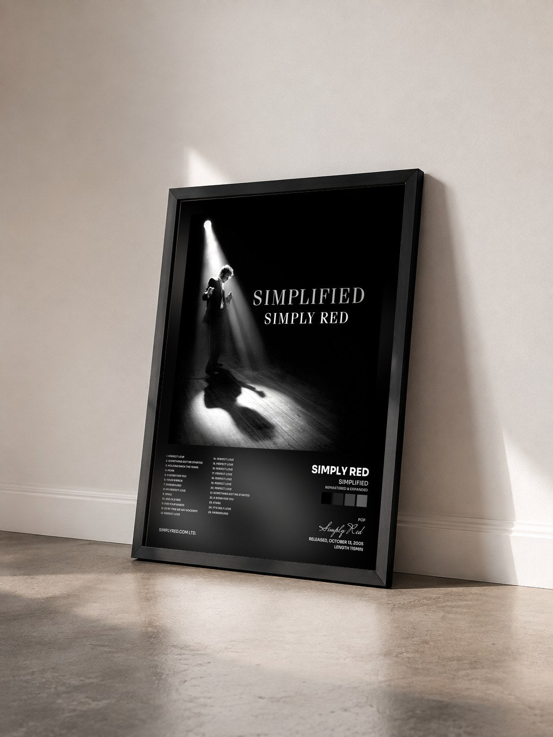 #noir Simplified (Remastered & Expanded) by Simply Red as a framed art print seen at an angle, black frame
