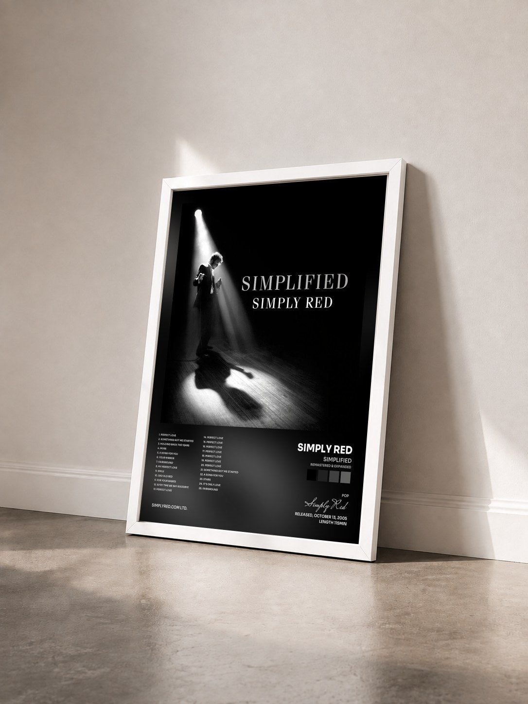 #blanc Simplified (Remastered & Expanded) by Simply Red as a framed art print seen at an angle, white frame