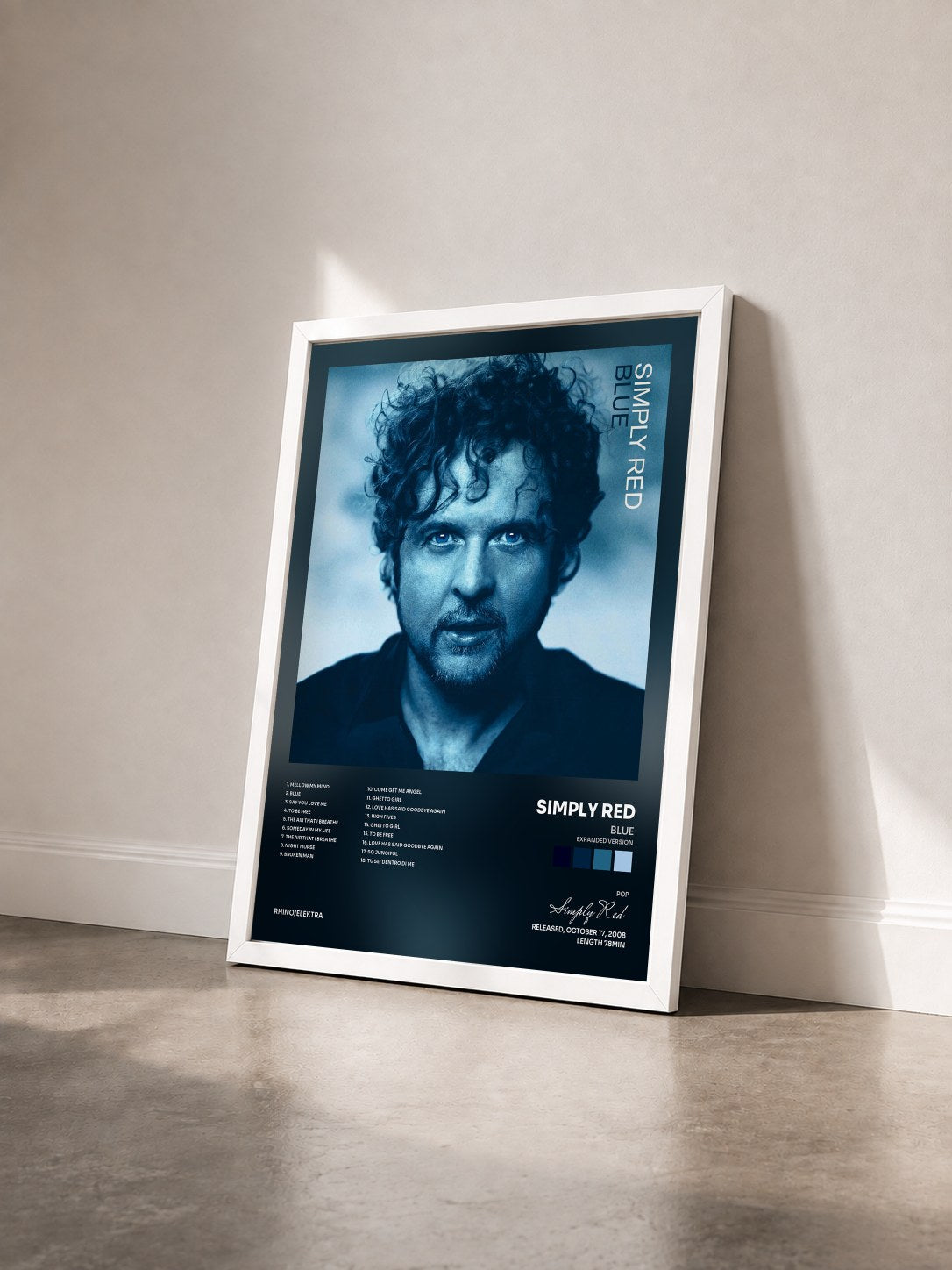 #blanc Blue (Expanded Version) by Simply Red as a framed art print seen at an angle, white frame