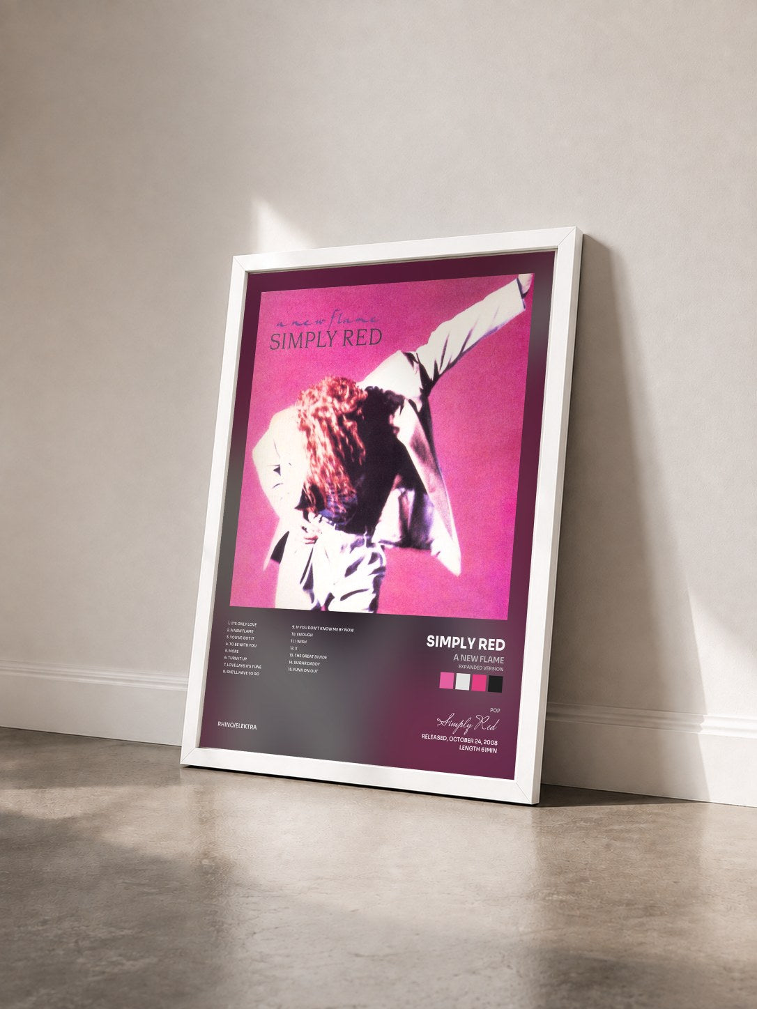 #blanc A New Flame (Expanded Version) by Simply Red as a framed art print seen at an angle, white frame