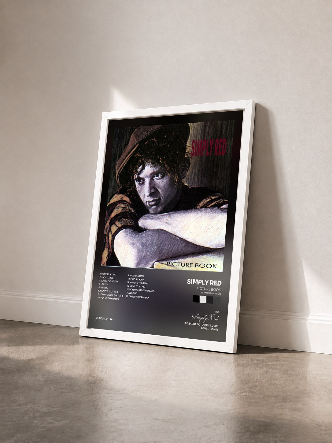 #blanc Picture Book (Expanded Version) by Simply Red as a framed art print seen at an angle, white frame
