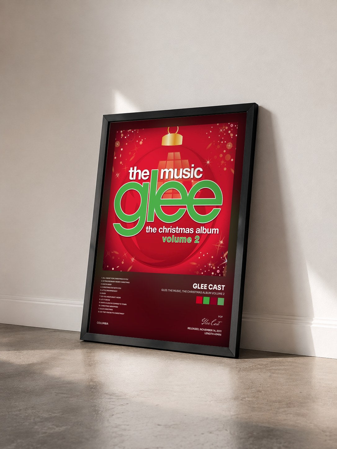 #noir Glee: The Music, The Christmas Album Volume 2 by Glee Cast as a framed art print seen at an angle, black frame