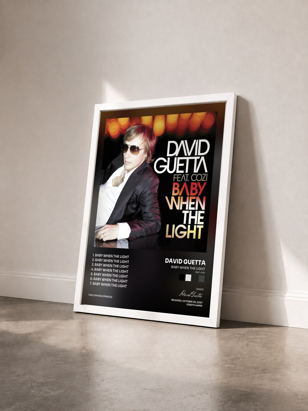 #blanc Tableau de l'album Baby When The Light (feat. Cozi) de David Guetta vu de trois quarts, cadre blanc