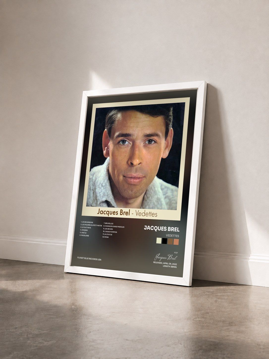 #blanc Tableau de l'album Vedettes de Jacques Brel vu de trois quarts, cadre blanc