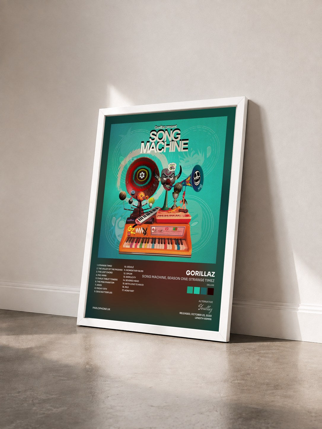 #blanc Tableau de l'album Song Machine, Season One: Strange Timez (Deluxe) de Gorillaz vu de trois quarts, cadre blanc