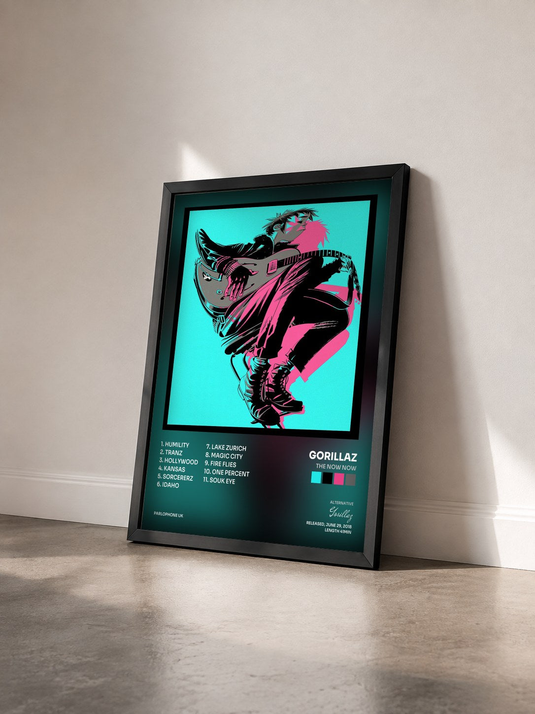 #noir The Now Now by Gorillaz as a framed art print seen at an angle, black frame