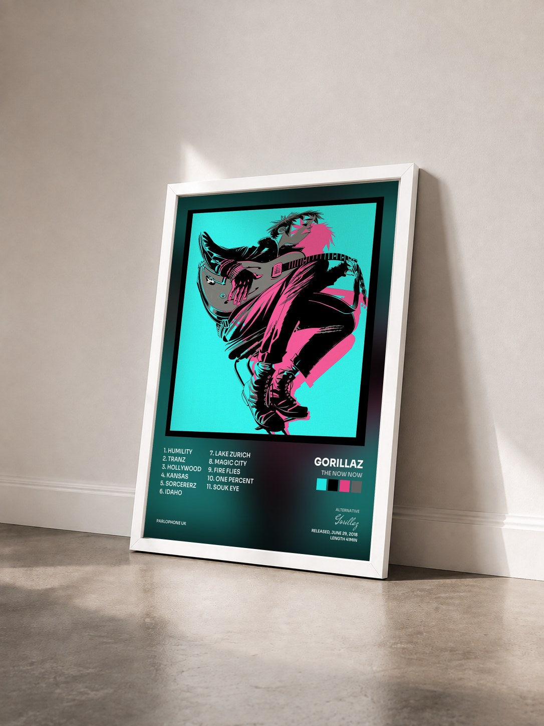 #blanc The Now Now by Gorillaz as a framed art print seen at an angle, white frame