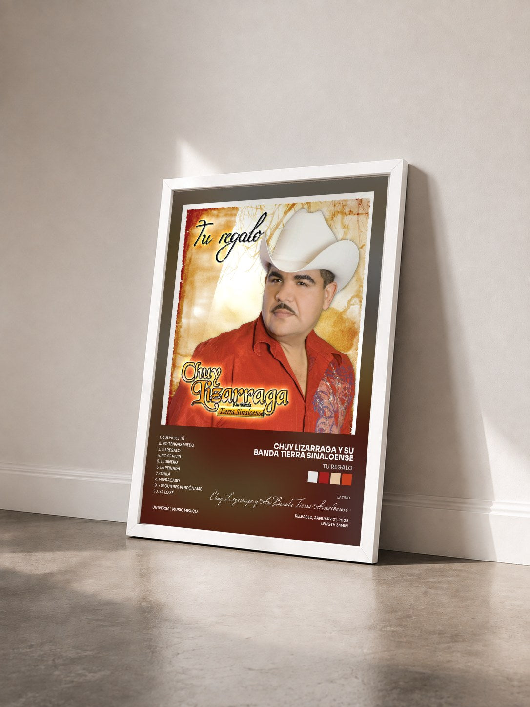 #blanc Tableau de l'album Tu Regalo de Chuy Lizarraga y Su Banda Tierra Sinaloense vu de trois quarts, cadre blanc