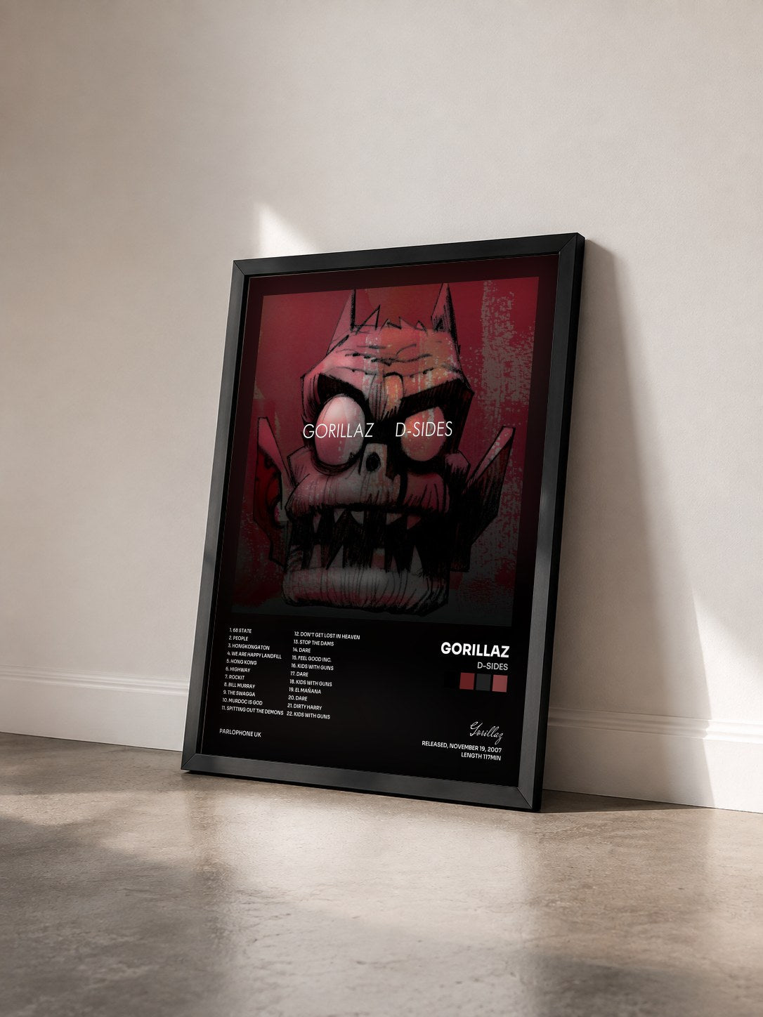 #noir Tableau de l'album D-Sides de Gorillaz vu de trois quarts, cadre noir