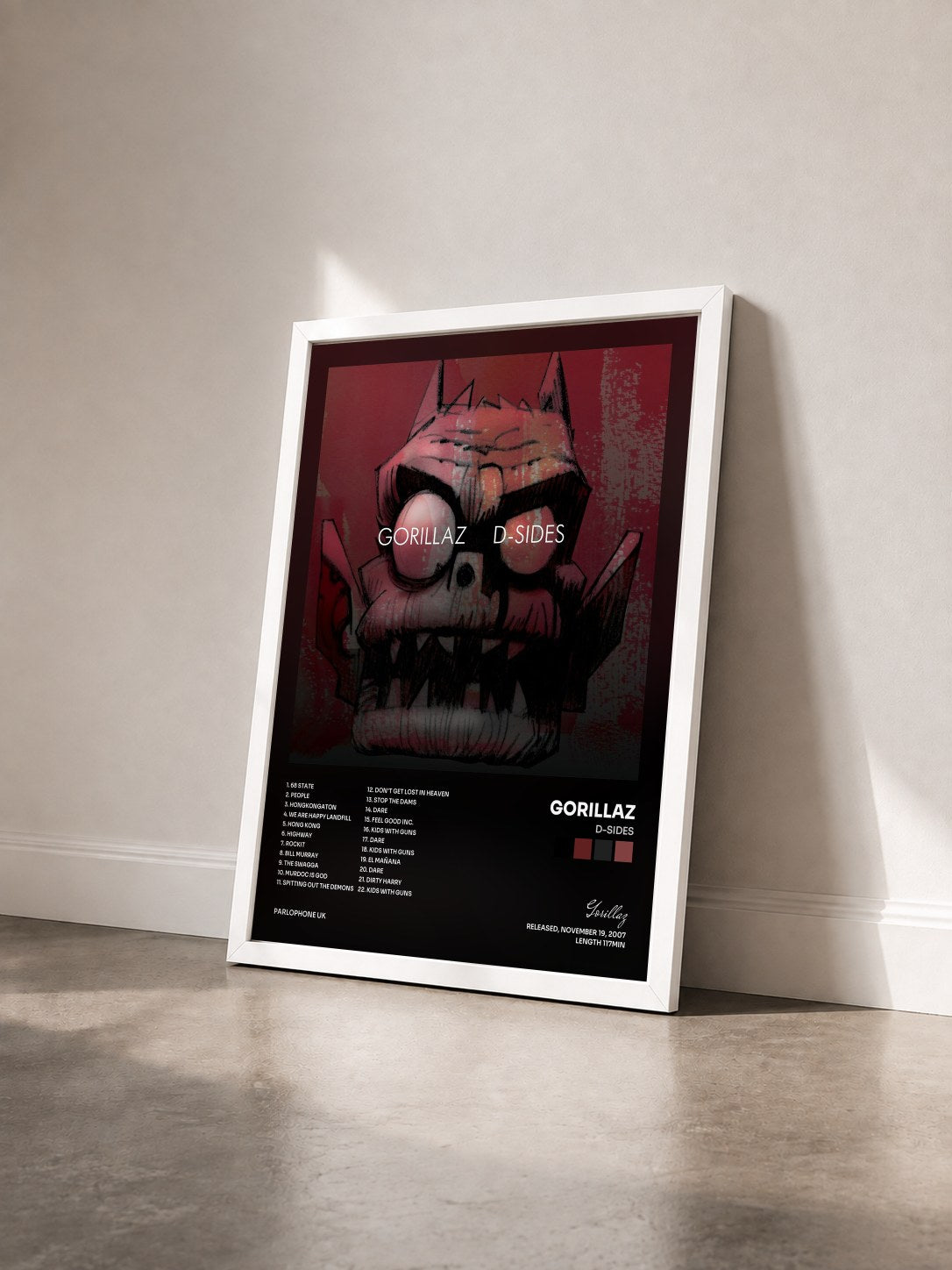 #blanc Tableau de l'album D-Sides de Gorillaz vu de trois quarts, cadre blanc