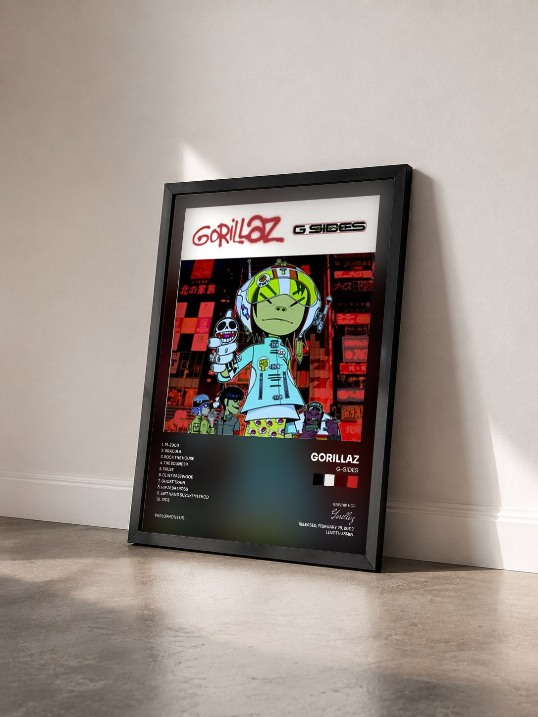 #noir Tableau de l'album G-Sides de Gorillaz vu de trois quarts, cadre noir