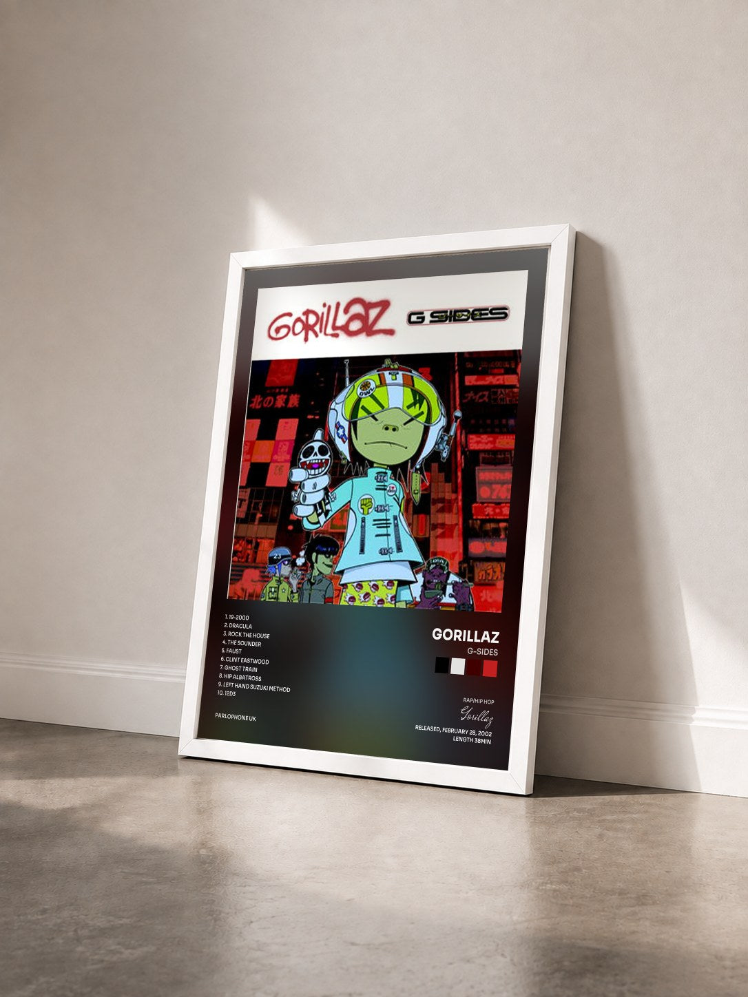#blanc Tableau de l'album G-Sides de Gorillaz vu de trois quarts, cadre blanc