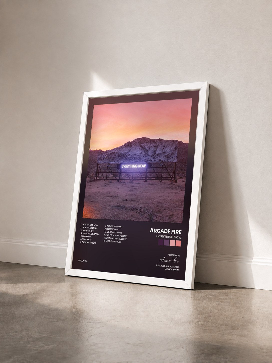 #blanc Tableau de l'album Everything Now de Arcade Fire vu de trois quarts, cadre blanc
