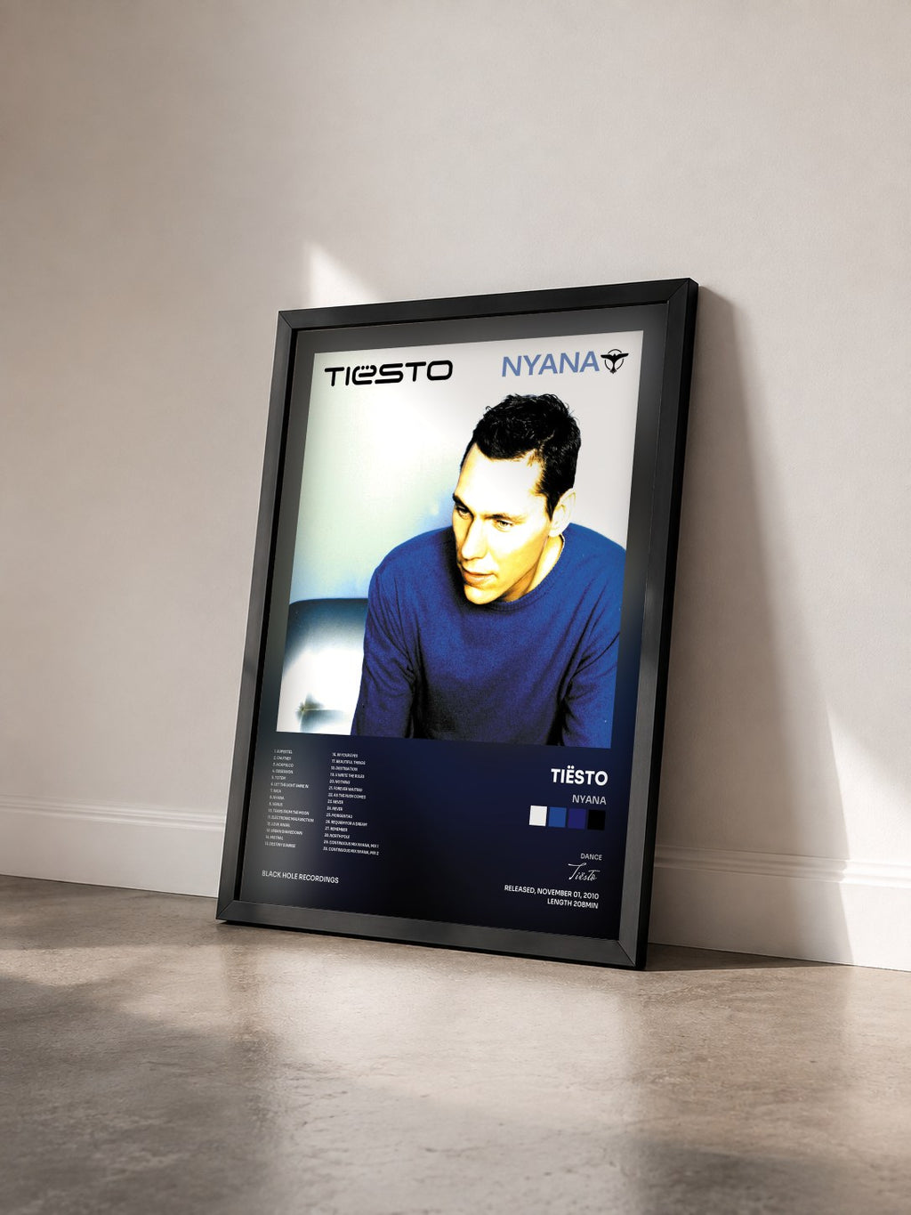 #noir Tableau de l'album Nyana de Tiësto vu de trois quarts, cadre noir
