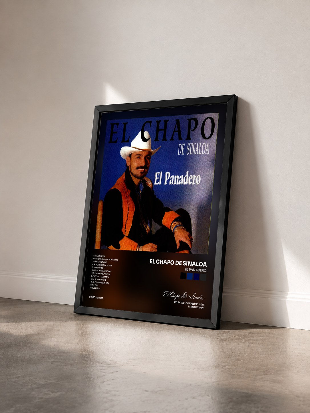#noir Tableau de l'album El Panadero de El Chapo De Sinaloa vu de trois quarts, cadre noir