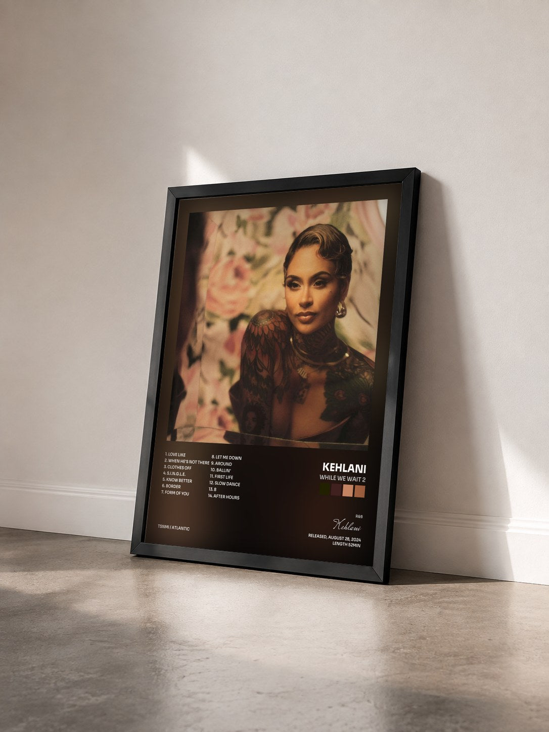 #noir While We Wait 2 by Kehlani as a framed art print seen at an angle, black frame