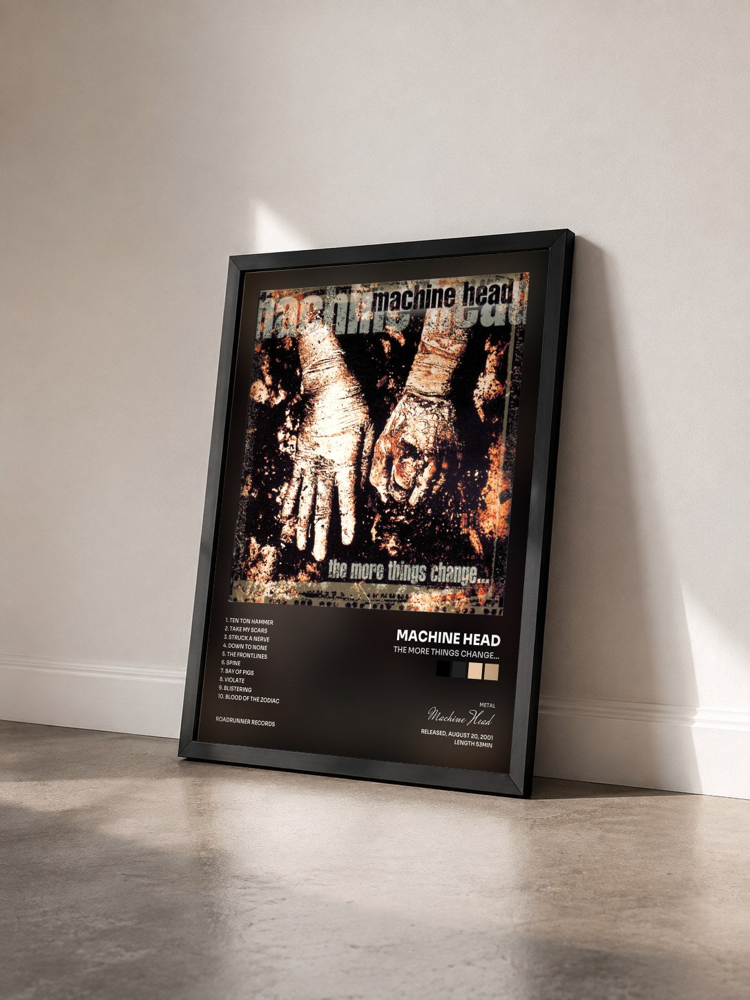 #noir Tableau de l'album The More Things Change... de Machine Head vu de trois quarts, cadre noir