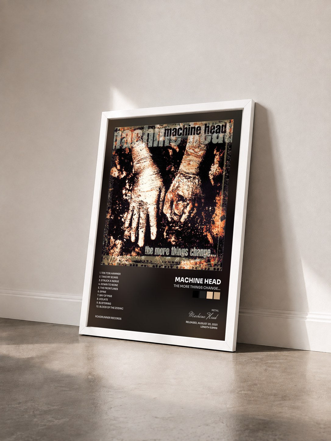 #blanc Tableau de l'album The More Things Change... de Machine Head vu de trois quarts, cadre blanc