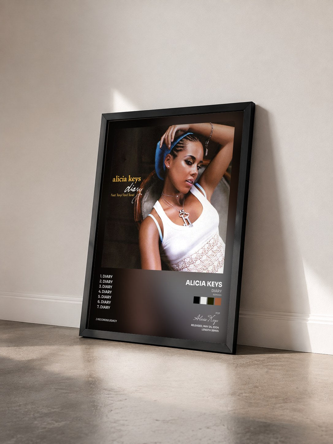 #noir Tableau de l'album Diary (Remixes) de Alicia Keys vu de trois quarts, cadre noir