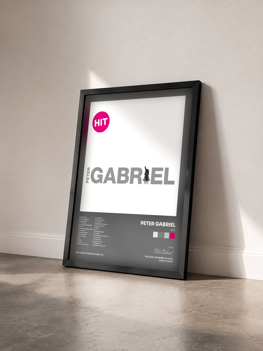 #noir Tableau de l'album Hit de Peter Gabriel vu de trois quarts, cadre noir