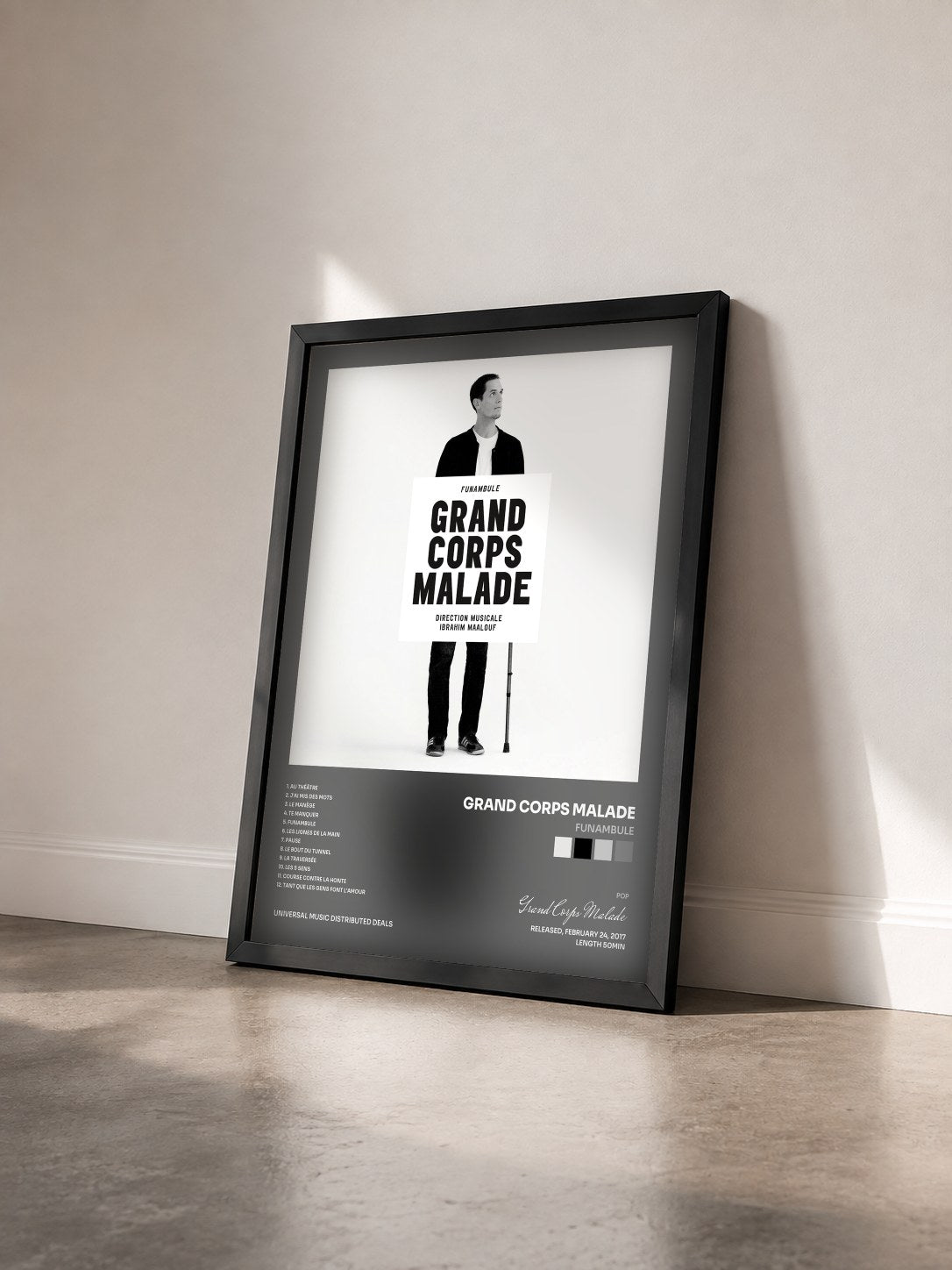 #noir Tableau de l'album Funambule de Grand Corps Malade vu de trois quarts, cadre noir