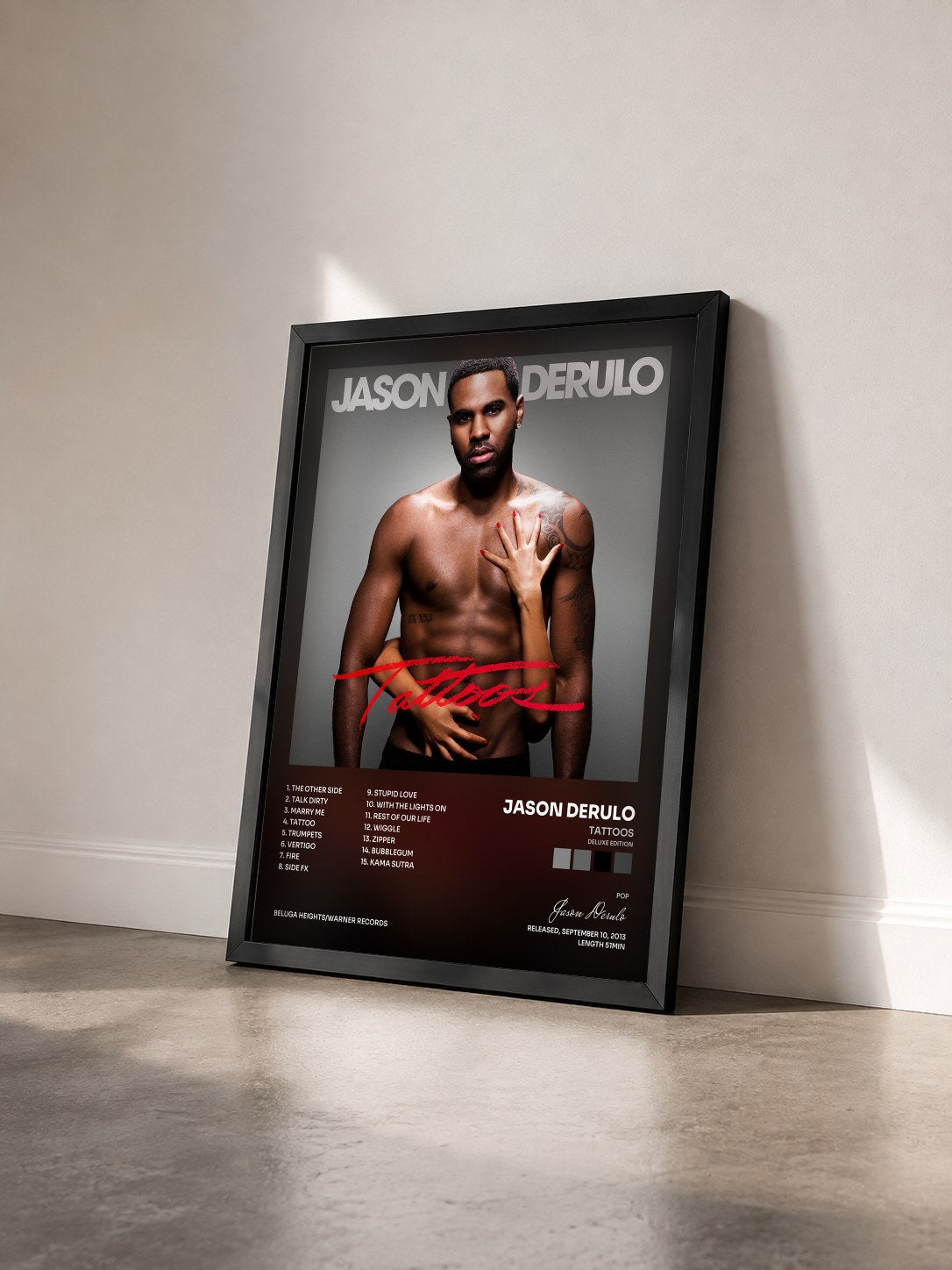 #noir Tattoos (Deluxe Edition) by Jason Derulo as a framed art print seen at an angle, black frame