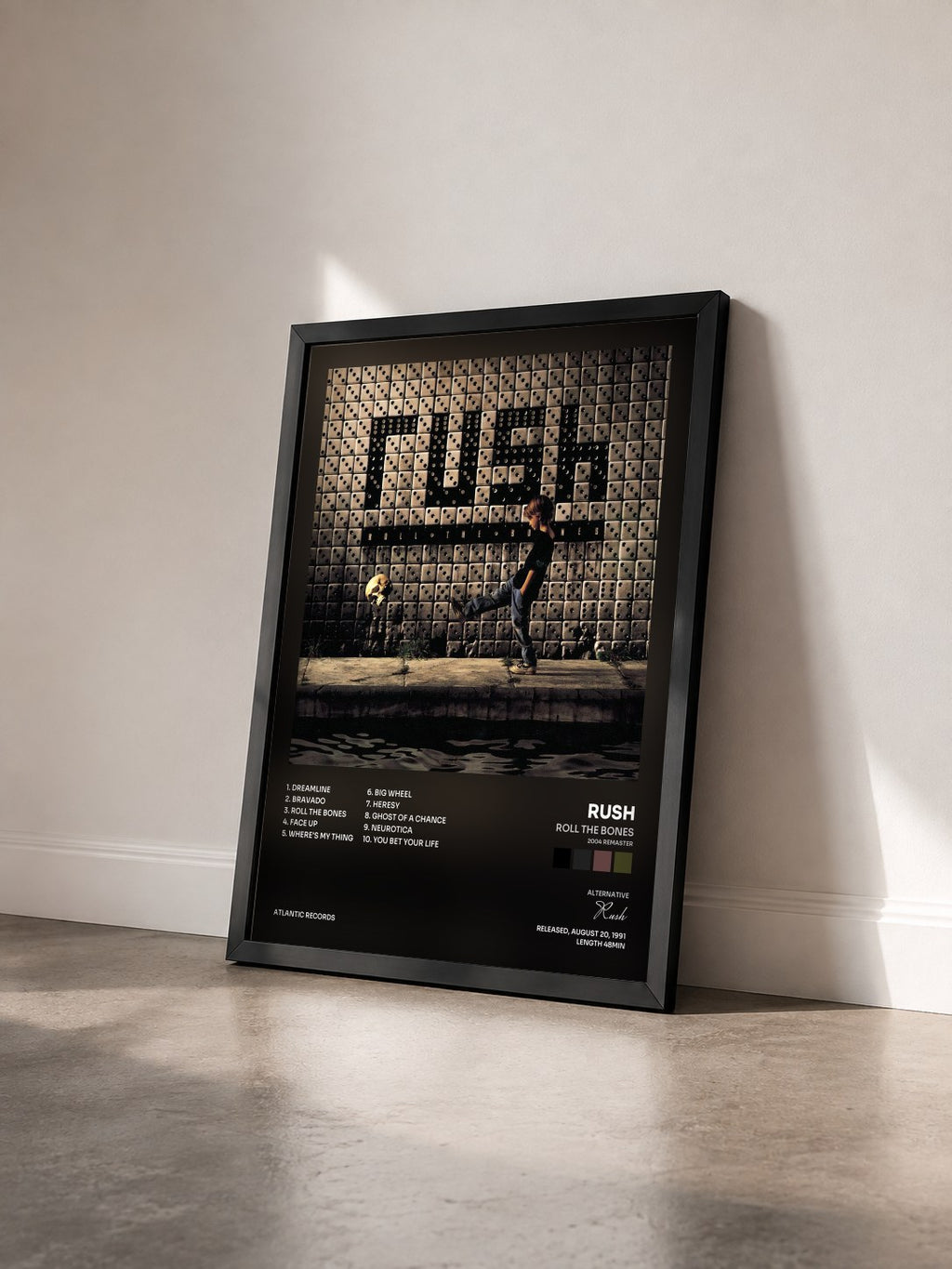 #noir Tableau de l'album Roll the Bones (2004 Remaster) de Rush vu de trois quarts, cadre noir