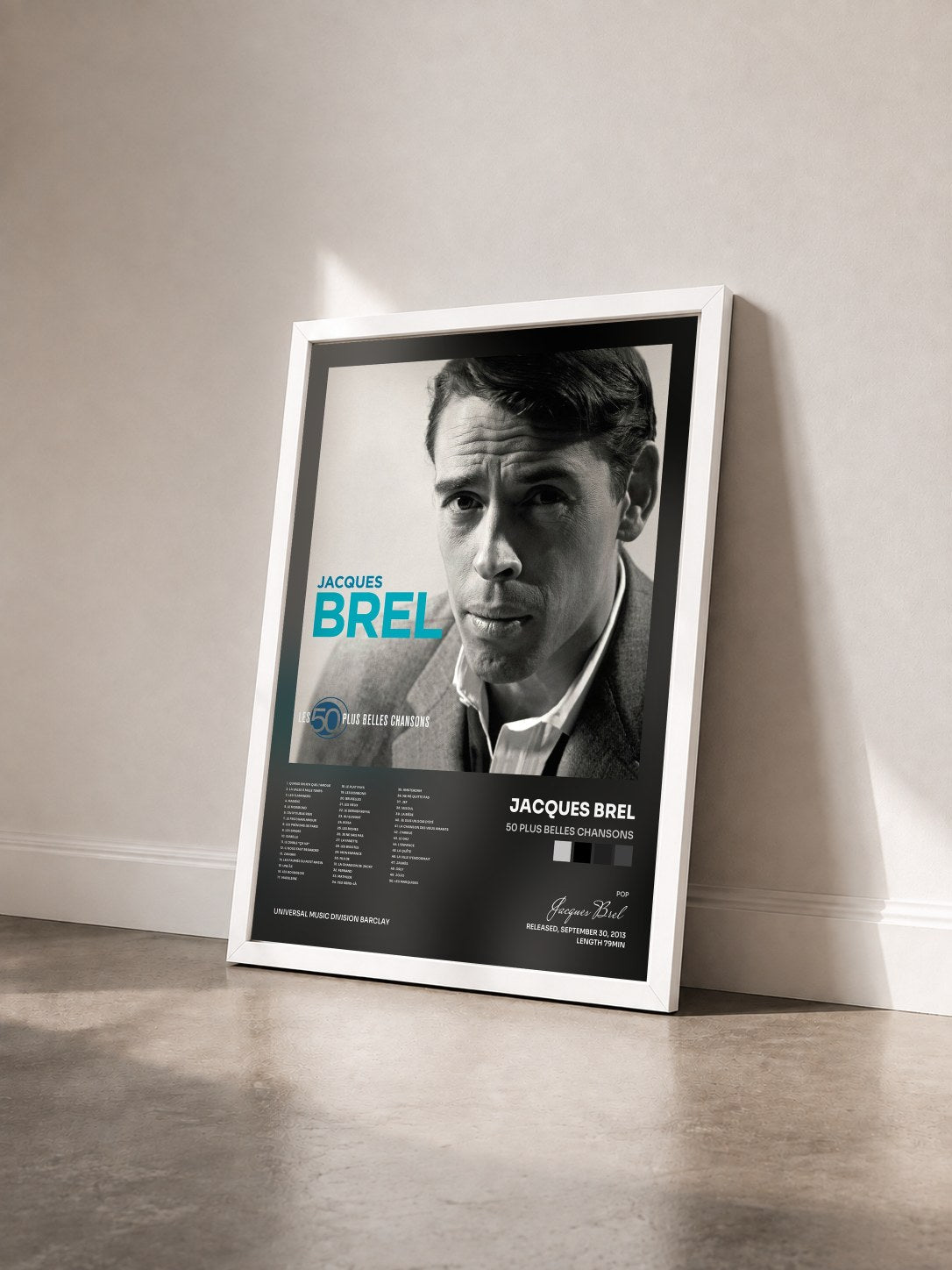 #blanc Tableau de l'album 50 Plus Belles Chansons de Jacques Brel vu de trois quarts, cadre blanc