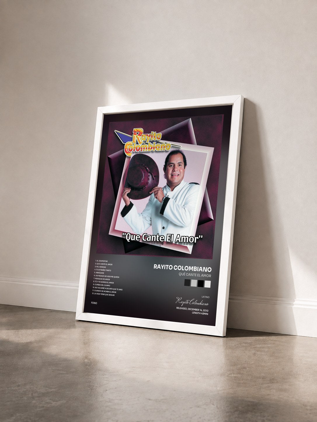 #blanc Tableau de l'album Qué Cante El Amor de Rayito Colombiano vu de trois quarts, cadre blanc