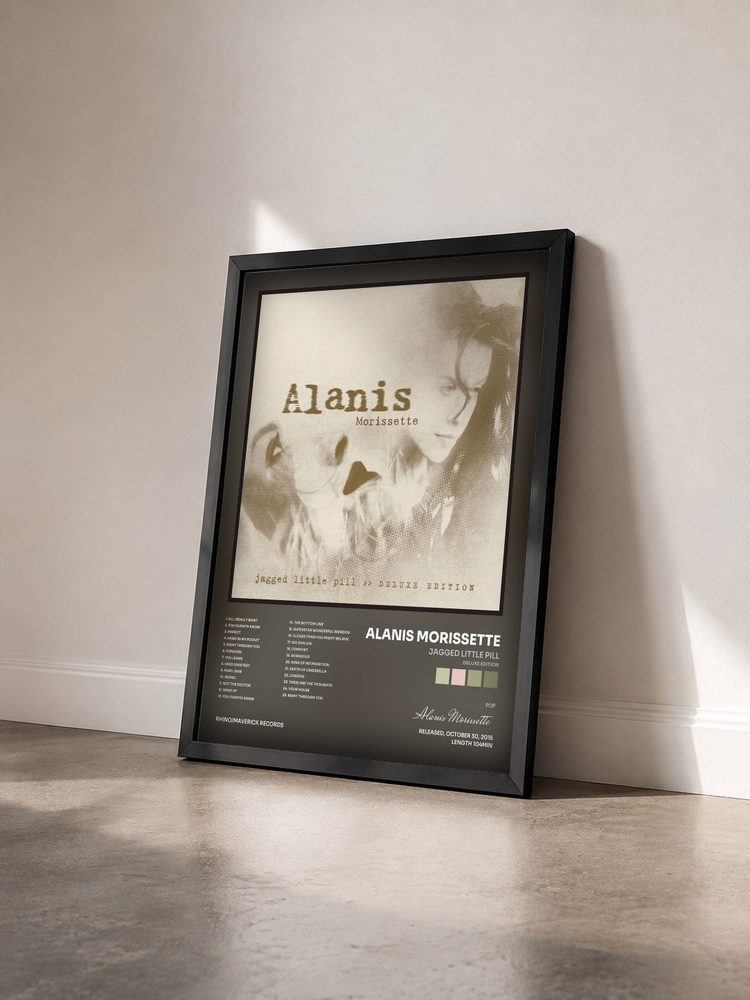 #noir Tableau de l'album Jagged Little Pill (Deluxe Edition) de Alanis Morissette vu de trois quarts, cadre noir