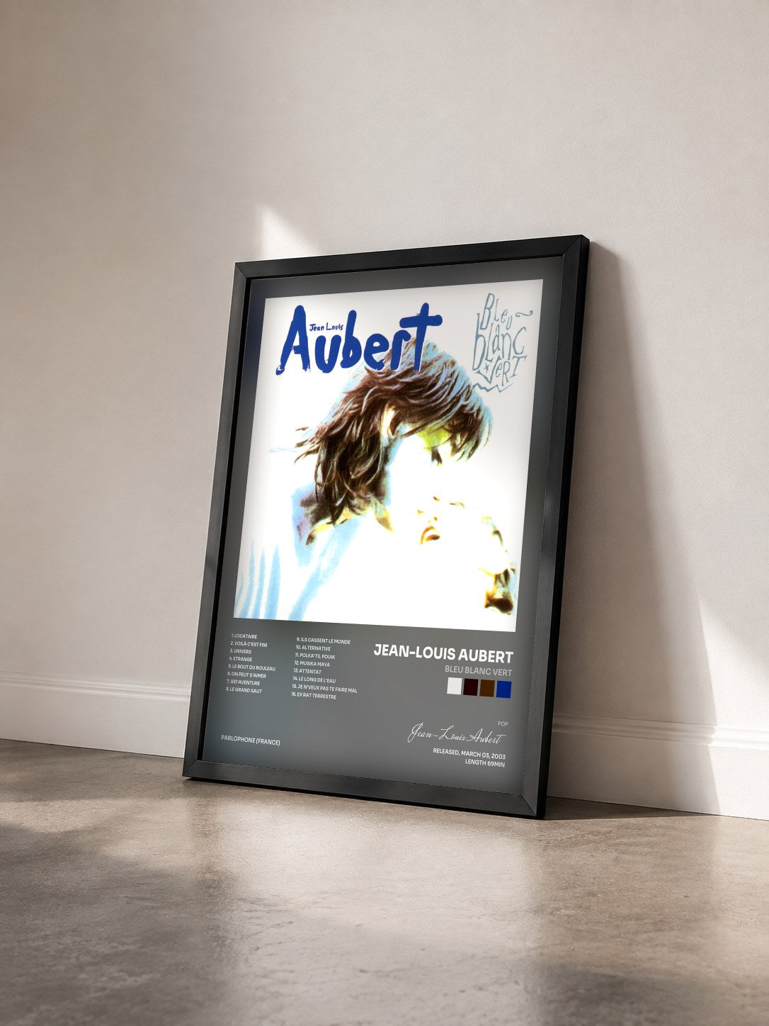 #noir bleu blanc vert by Jean-Louis Aubert as a framed art print seen at an angle, black frame