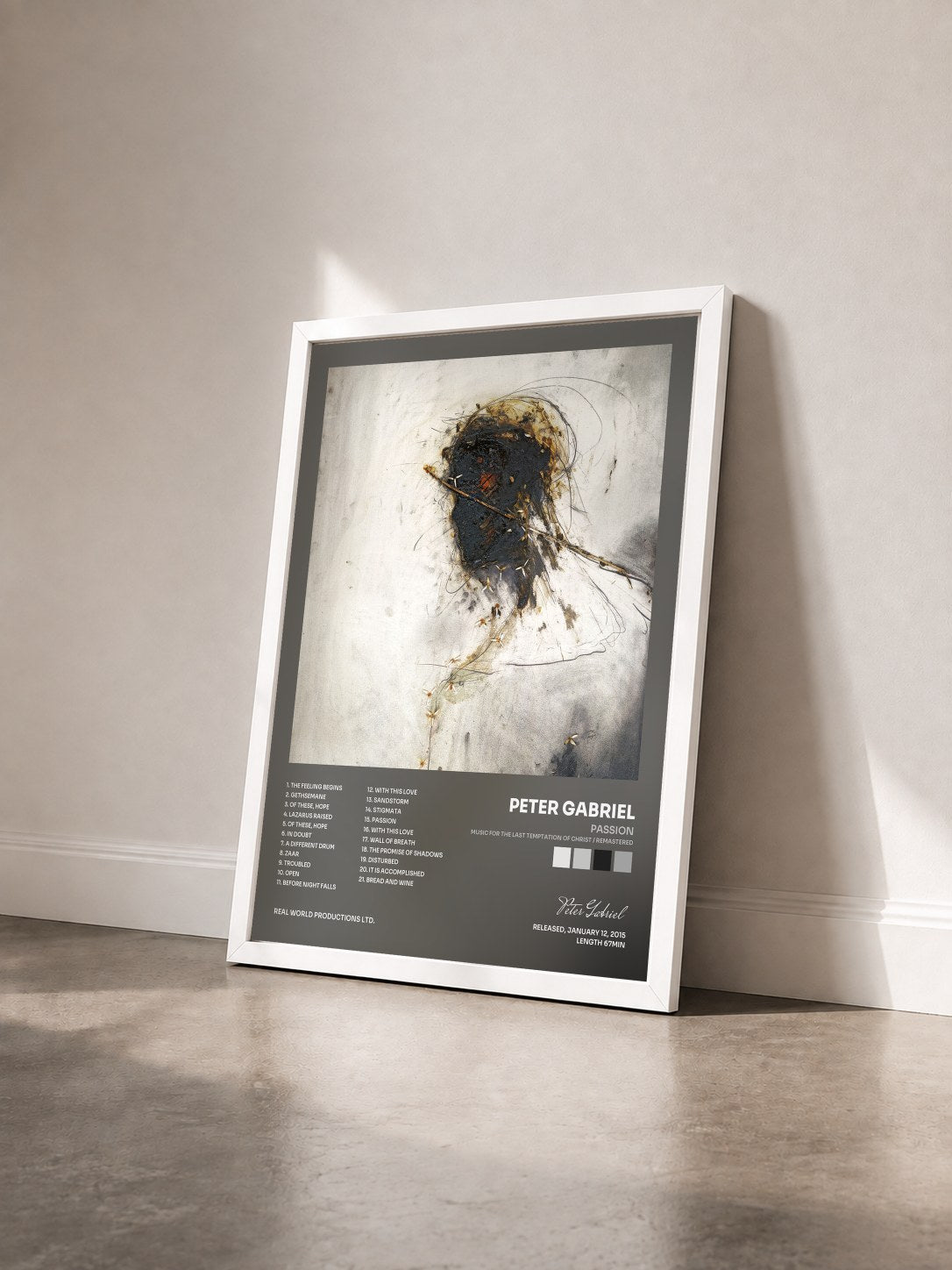 #blanc Tableau de l'album Passion (Music For The Last Temptation Of Christ / Remastered) de Peter Gabriel vu de trois quarts, cadre blanc