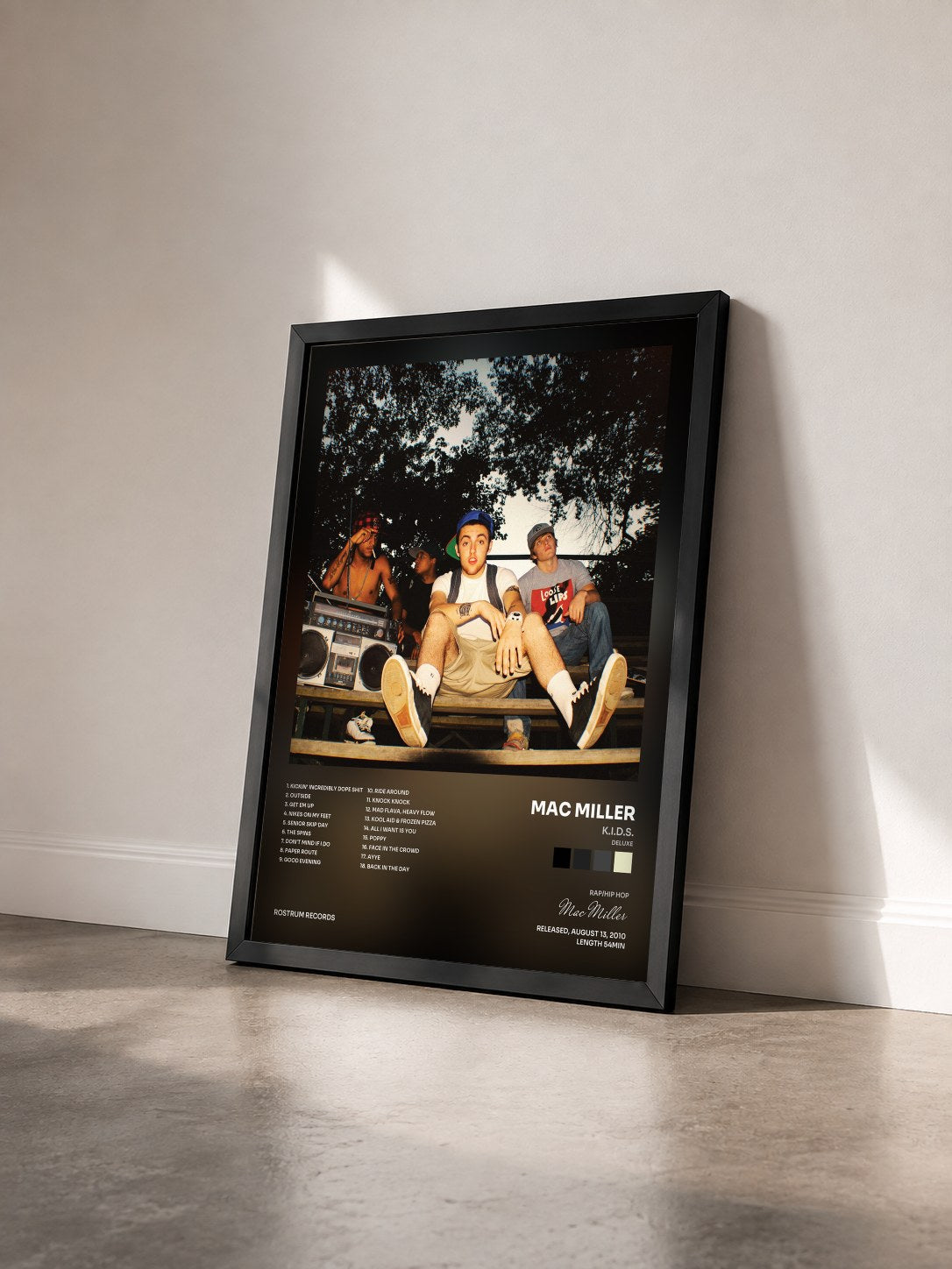 #noir K.I.D.S. (Deluxe) by Mac Miller as a framed art print seen at an angle, black frame