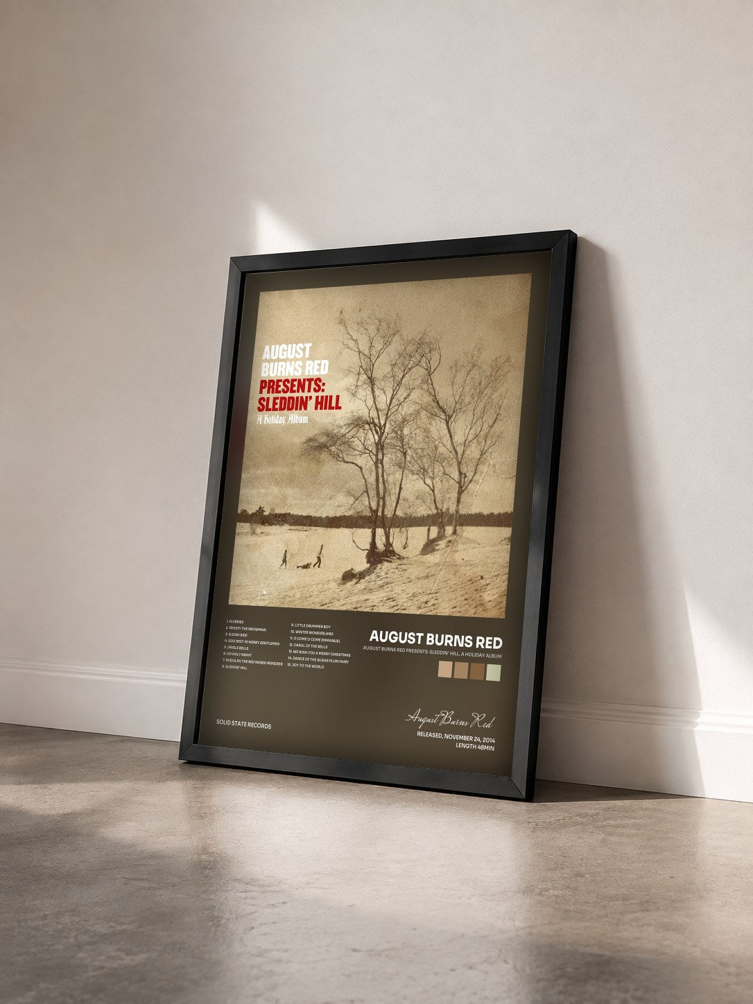 #noir Tableau de l'album August Burns Red Presents: Sleddin' Hill, A Holiday Album de August Burns Red vu de trois quarts, cadre noir