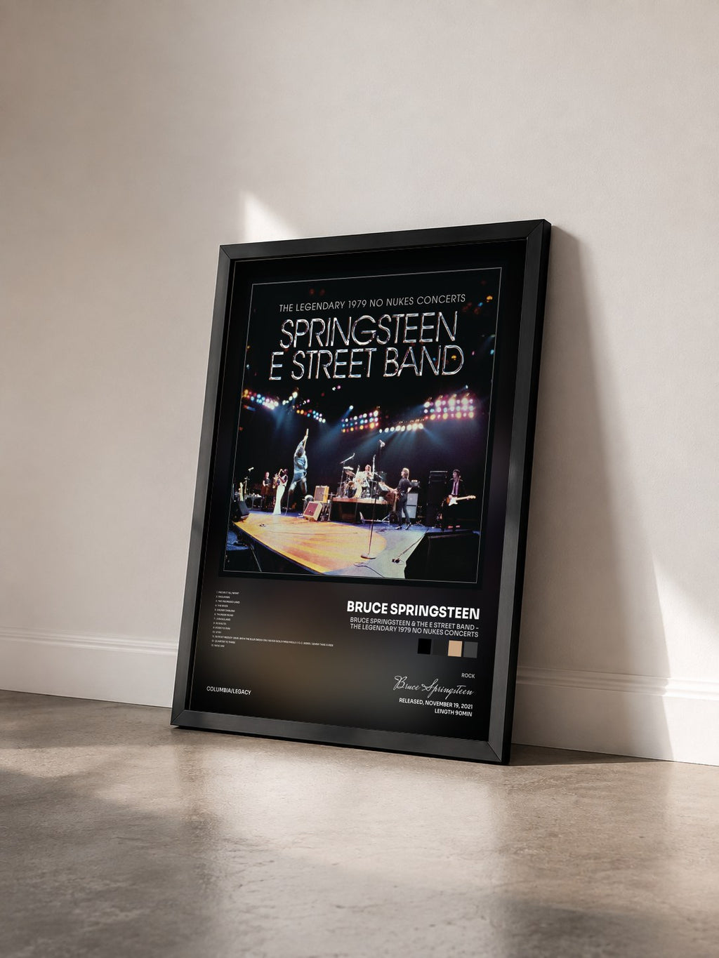 #noir Bruce Springsteen & The E Street Band - The Legendary 1979 No Nukes Concerts by Bruce Springsteen as a framed art print seen at an angle, black frame