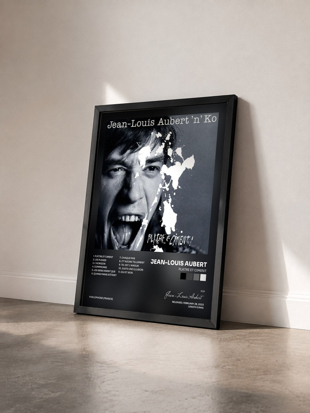 #noir platre et ciment by Jean-Louis Aubert as a framed art print seen at an angle, black frame